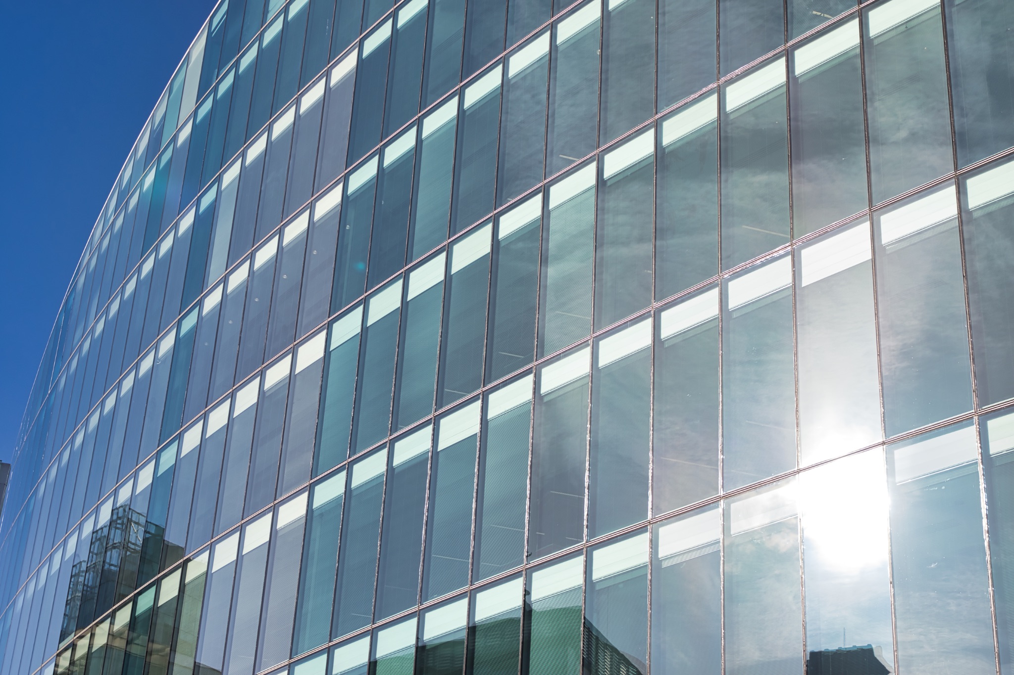 Glass Facade of a Modern Building in Manchester, UK.